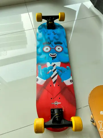 Used colorful longboard skateboard with graphic deck and yellow wheels