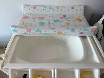 Baby changing station with built-in bath and storage — good condition