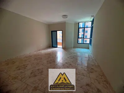 For sale: Spacious apartment in Al Nuaimiya Towers, Ajman, featuring 2 bedrooms, a living room, maid’s room, 3 bathrooms, 2 balconies, and a total are