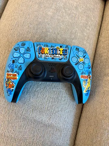 Used PS5 DualSense controller with custom blue sticker skin - working condition
