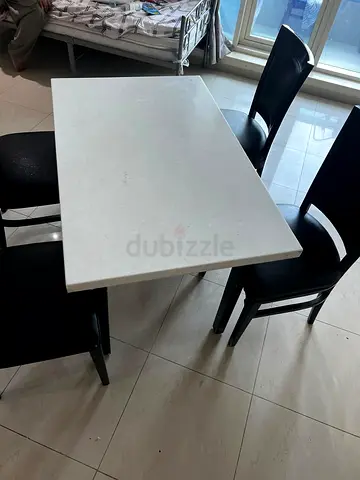 Modern Dining Table with Four Black Chairs