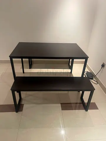 dark wood dining table with two benches