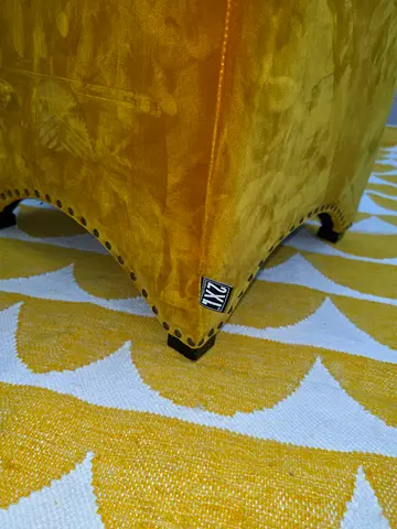 Yellow Velvet Upholstered Ottoman with Nailhead Trim