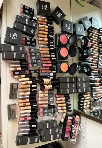 Bulk professional makeup lot — foundations, concealers, lipsticks, blushes, palettes
