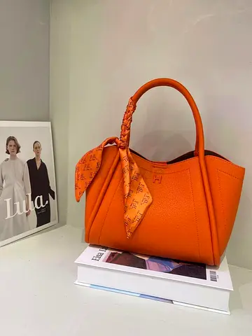 Hermes master copy Orange leather tote handbag with scarf detail - gently used