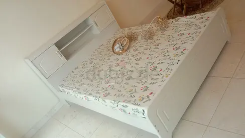White Bed Frame with Built-in Headboard Storage . Without Mattress.