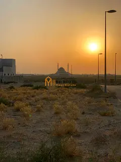 For sale in Tilal City: a commercial plot with a G+3 building permit. It features a prime location o