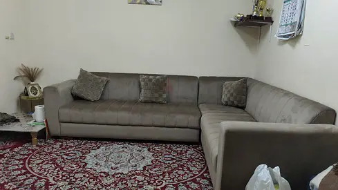 L-shaped grey fabric corner sofa — good condition