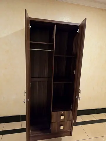 Dark wood wardrobe with shelves and drawers - good condition