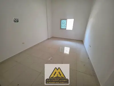 Annual rent: Studio in Al Rashidiya 3, ground floor, separate kitchen, central AC, modern building, near the park, AED 23K in 4 payments.