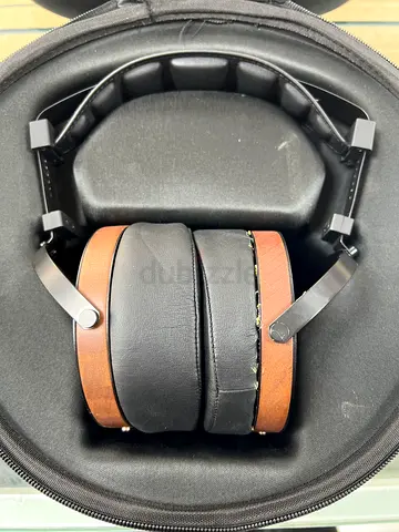 Monolith M1060 planar. Over-ear wireless headphones with brown wooden accents — good