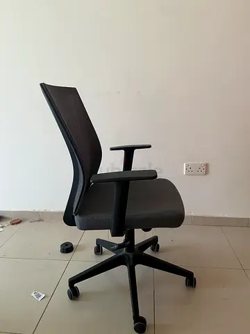 Black ergonomic office chair with wheels, good used condition