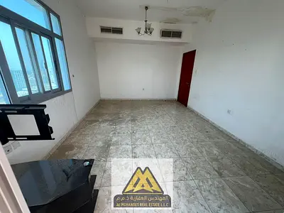 For annual rent, a one-bedroom apartment in Al Rashidiya 3, Ajman, in a prime location near Lulu Hypermarket, bus station, Amina Hospital, and Al Ahli