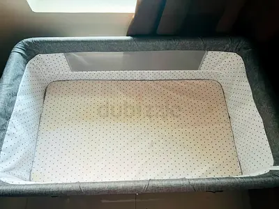 Used Portable Bassinet / Baby Crib - Grey with Mesh Sides