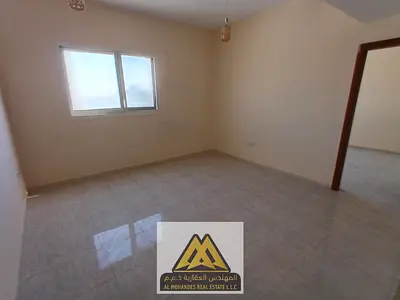 A special apartment for annual rent in Al Jurf Industrial 3, featuring a large space and practical layout that provides comfort, located in a quiet bu
