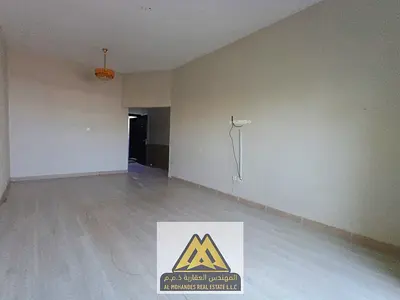 Annual rent: 2-bedroom apartment with separate living room in Al Rawda 2, Ajman. Balcony, split AC, built-in wardrobes, near Layali Beirut. Rent: AED