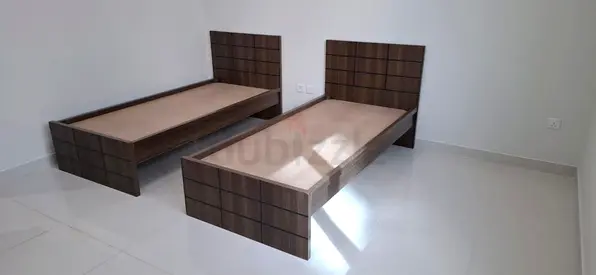 Pair of single wooden beds with headboards – good quality
