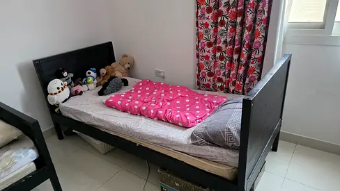 Single black wooden bed from Ikea - without mattress — good condition
