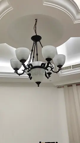 Two matching large classic-style ceiling chandeliers for sale.