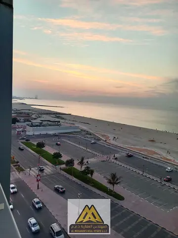 Two-bedroom apartment with a living room on the corniche, sea view, prime location, and 24-hour service.
