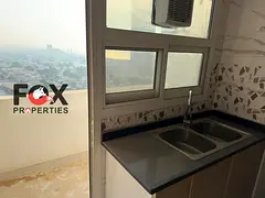 Luxury apartment for annual rent in Al Rumaila, in a prime location and steps from the Corniche