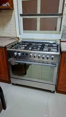 Used freestanding stainless steel gas cooker with oven - good working condition