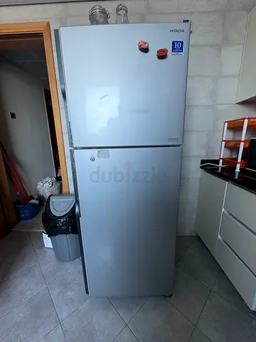 Silver double-door refrigerator in good working condition