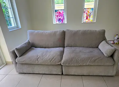 Comfortable 2 sectional 3-Seater sized Light Grey Sofa - Good Condition