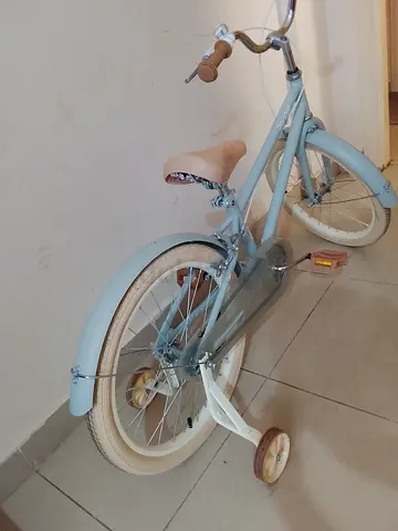 Childs light blue bicycle with training wheels - good condition