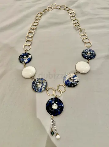 Silver-tone necklace with blue marble disc accents and dangling beads