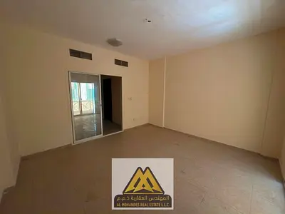 غرفتين وصالة للإيجار السنوي | موقع مميز | بناية الكمل | النعيمية 2 | 34,990 درهم