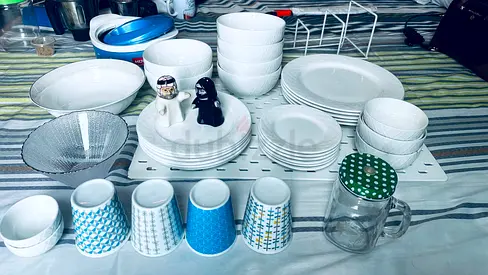 Dining crockery set — assorted white plates, bowls and cups (used)