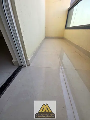 3 bedrooms and a living room with a balcony offering an open view, in a large area in Al Jurf 2, opposite Ajman Court, close to all services.