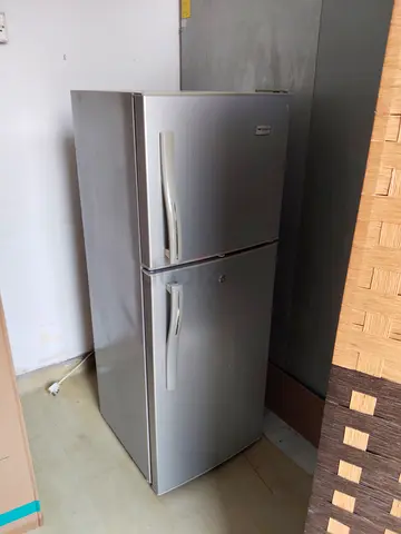 Silver two-door refrigerator - good working condition