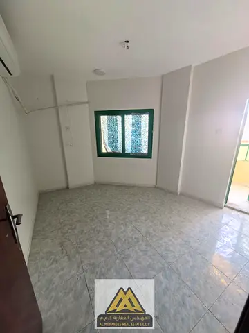Two-bedroom apartment with a living room in Rashidiya 3, Ajman, 35,000 AED yearly, 4 or 6 payments, split AC, 2 bathrooms, 2 balconies, prime location