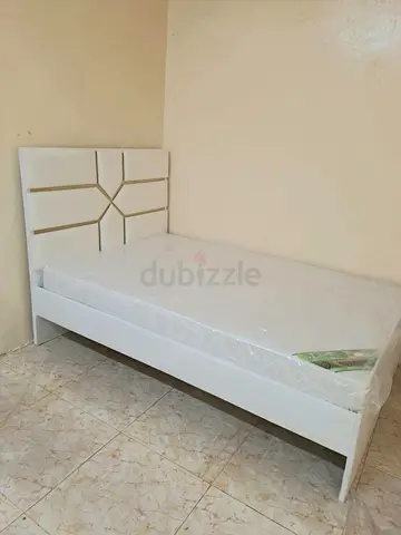 Modern White Single Bed with Patterned Headboard
