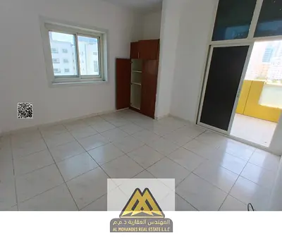 Annual rent: 2-bedroom apartment in Al Rashidiya 3 with balcony, 2 bathrooms, built-in wardrobes, central AC, free maintenance, AED 38,000, payable in