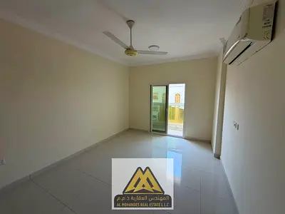A spacious one-bedroom apartment with a balcony and a view in Al Muwaihat 1, near Sheikh Ammar Street and Al Tallah Street in Al Muwaihat 1.