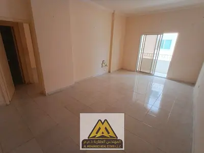 One-bedroom master apartment for annual rent in Al Rashidiya 3, Ajman. Balcony, 2 bathrooms, central AC, near Grand Mall, easy access to Sharjah and D