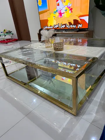 Glass and gold metal coffee table with lower shelf - excellent condition