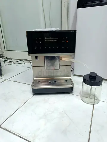 Miele CM 6360 MilkPerfection coffee machine features a metallic finish and an integrated touch displ