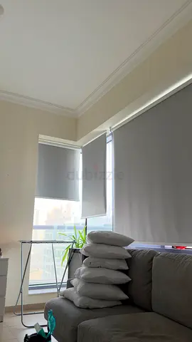 Grey roller blinds (pair) — light-blocking, good condition