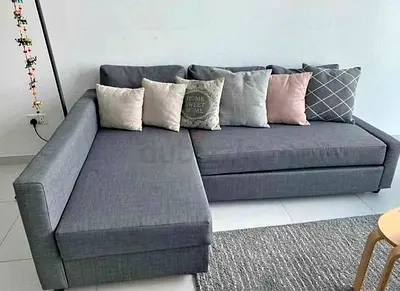 Grey L-Shaped Sofa with Cushions