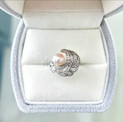 Elegant pearl and diamond cocktail ring in silver setting