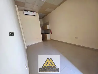 Annual rent: Studio in Al Rawda 2 with semi-separate kitchen, split AC, all bills included, close to services, AED 20,000, payable in 4 installments.