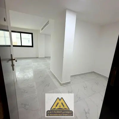 First occupancy studio apartment with a large area and separate kitchen in Al Tallah area, Ajman, next to Mohammed Bin Zayed Road.