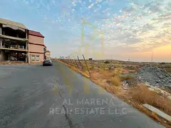 Prime residential/commercial land for sale in Al Zahia, Ajman, with a G+4 permit, measuring 4914 sq