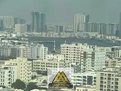 Largest apartment with 3 bedrooms, a living room, and a balcony with a view in Al Rashidiya 3 area, 