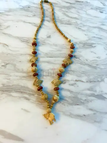 Hand-carved bone elephant necklace with wooden beads