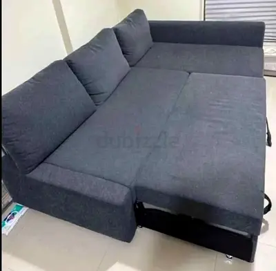 Dark Gray L-shaped Sofa Bed with Storage – Good Condition